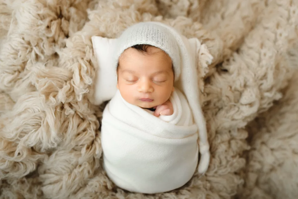 Newborn wrapped up for a Jacksonville studio photoshoot